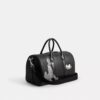 Bolso Compass 35 de Disney X Coach con Pluto