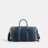 Bolso Compass 35 en denim de algodón regenerativo con Charms