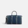 Bolso Compass 35 en denim de algodón regenerativo con Charms