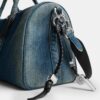 Bolso Compass 35 en denim de algodón regenerativo con Charms