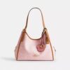 Bolso de hombro Erin en Signature Canvas con Charms