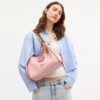Bolso de hombro Erin en Signature Canvas con Charms