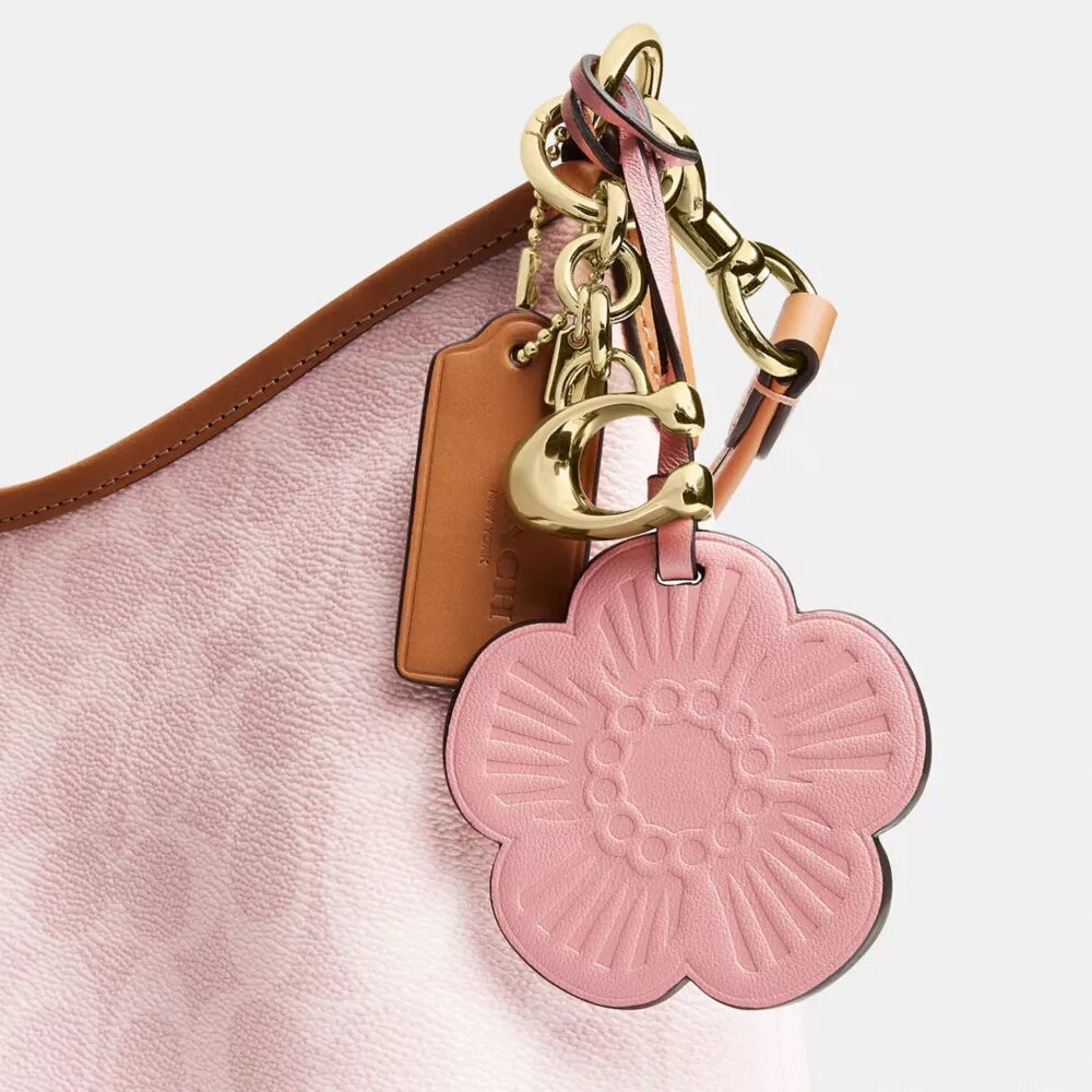 Bolso de hombro Laurel en Signature Canvas con Charms