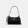 Bolso de hombro Teri en piel exclusiva con colgante de corazón