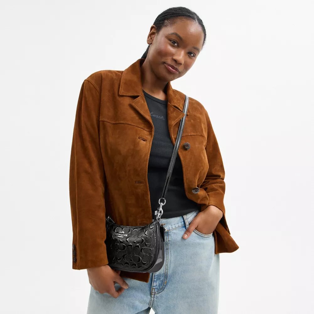 Bolso de hombro Teri en piel exclusiva con colgante de corazón