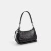 Bolso de hombro Teri en piel exclusiva con colgante de corazón
