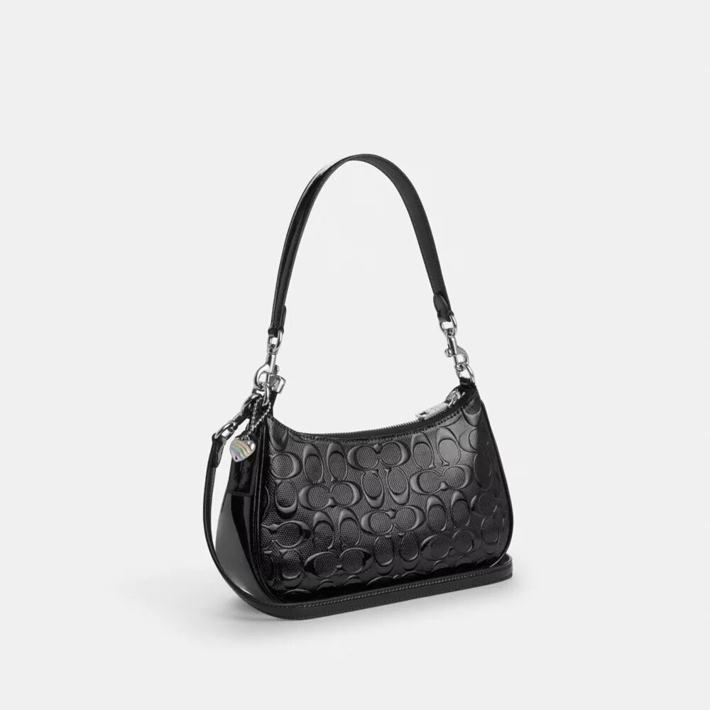 Bolso de hombro Teri en piel exclusiva con colgante de corazón