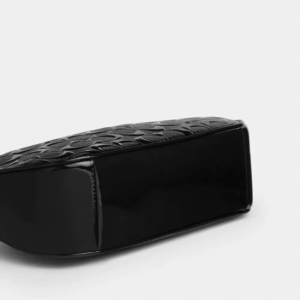 Bolso de hombro Teri en piel exclusiva con colgante de corazón