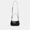 Bolso de hombro Teri en piel exclusiva con colgante de corazón
