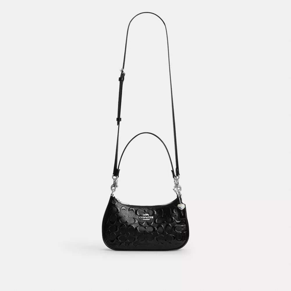 Bolso de hombro Teri en piel exclusiva con colgante de corazón