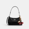 Bolso de hombro Teri en piel exclusiva con colgante de corazón