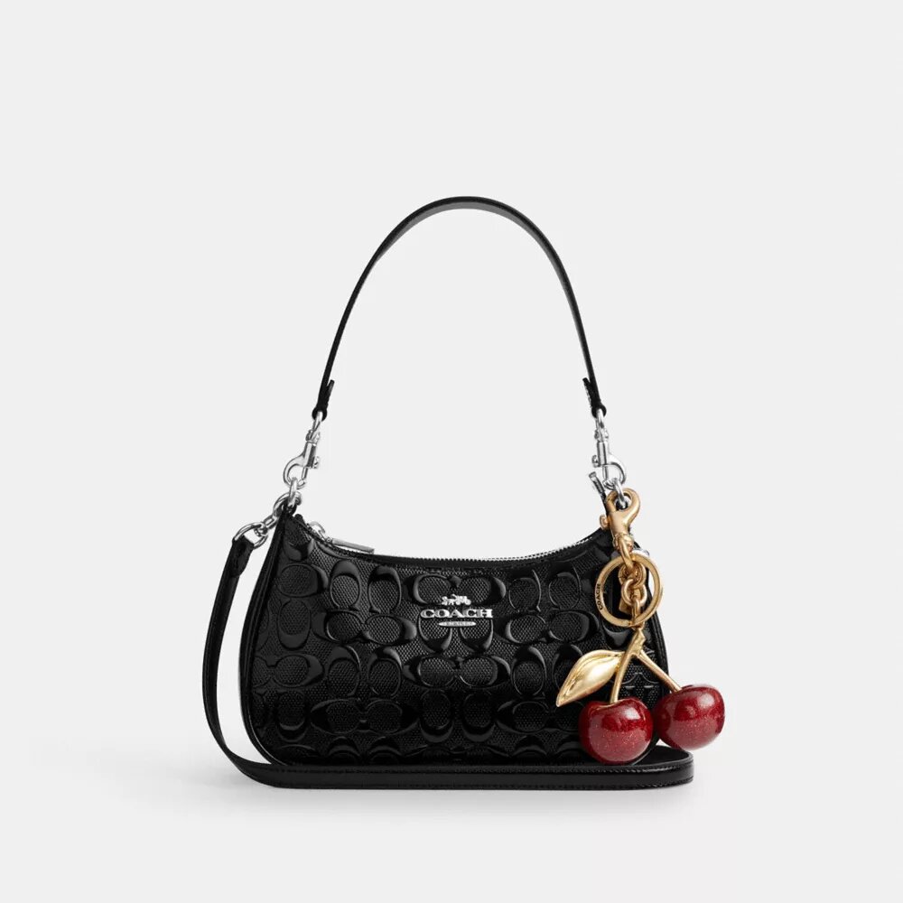 Bolso de hombro Teri en piel exclusiva con colgante de corazón