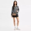Bolso de hombro Teri en Signature Canvas