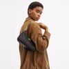Bolso de hombro Teri en Signature Canvas