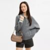Bolso de hombro Teri en Signature Canvas