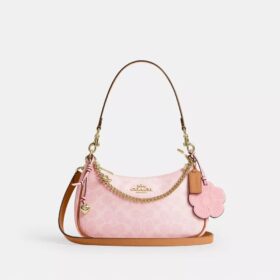 Bolso de hombro Teri en Signature Canvas con Charms