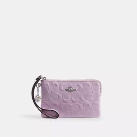 Bolso de pulsera con cremallera en la esquina, en piel exclusiva con Charms en forma de corazón