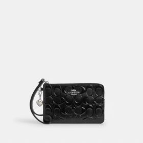 Bolso de pulsera con cremallera en la esquina, en piel exclusiva con Charms en forma de corazón