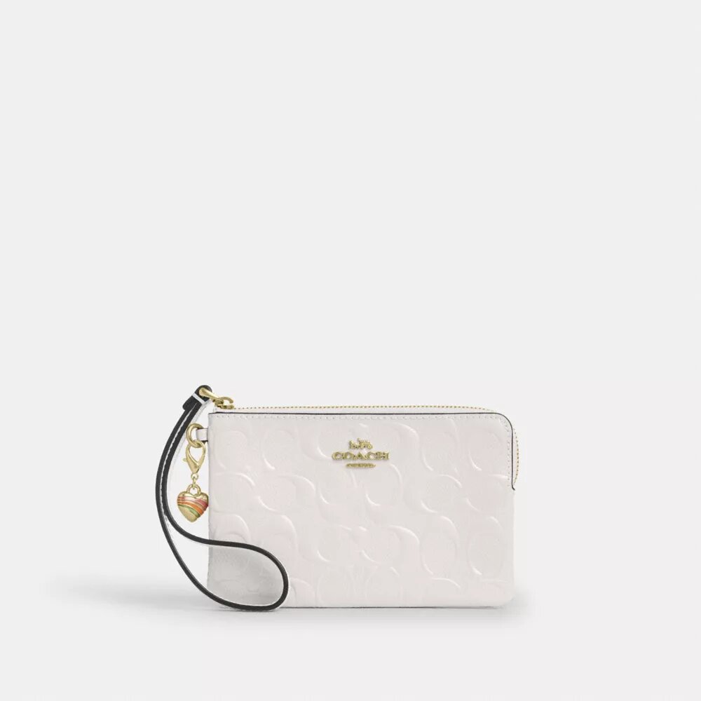 Bolso de pulsera con cremallera en la esquina, en piel exclusiva con Charms en forma de corazón