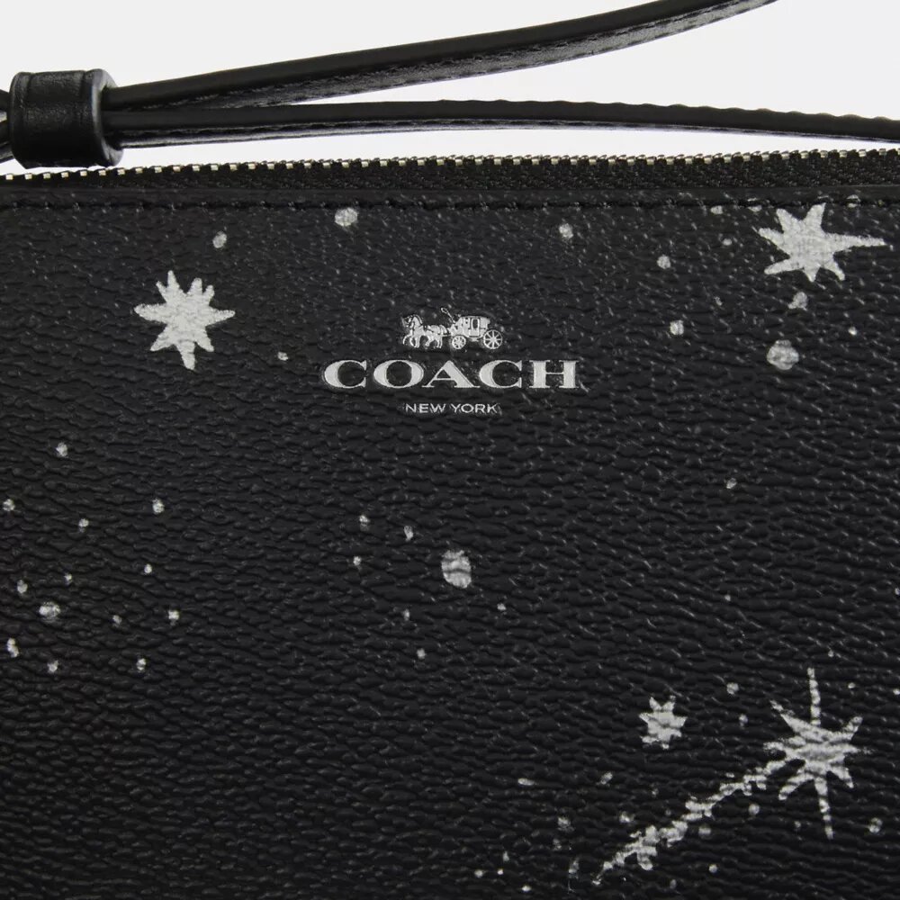 Bolso de pulsera con cremallera en la esquina y estampado de estrellas