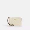 Bolso de pulsera con cremallera en las esquinas de piel exclusiva