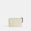 Bolso de pulsera con cremallera en las esquinas de piel exclusiva