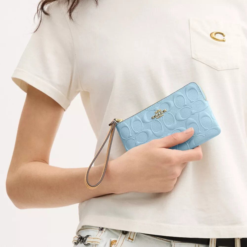 Bolso de pulsera con cremallera en las esquinas de piel exclusiva