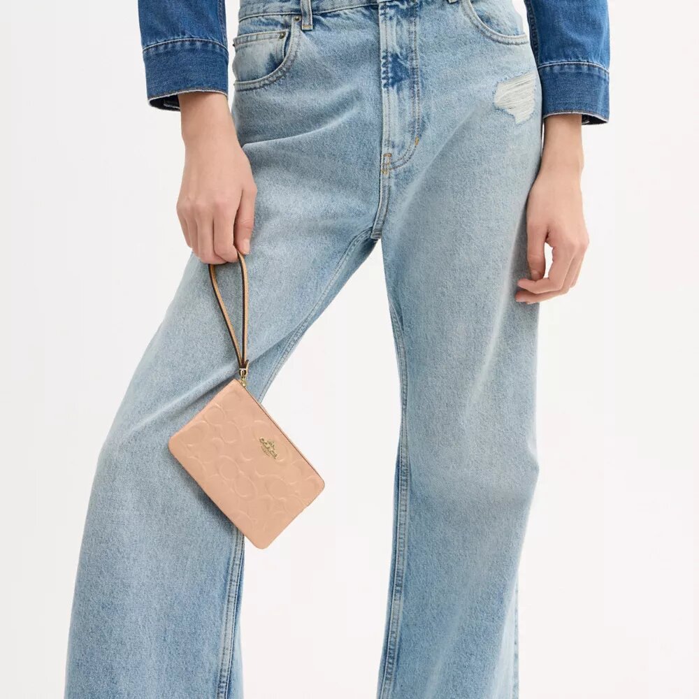 Bolso de pulsera con cremallera en las esquinas de piel exclusiva