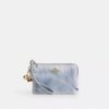 Bolso de pulsera con cremallera en las esquinas, en denim desgastado con Charms