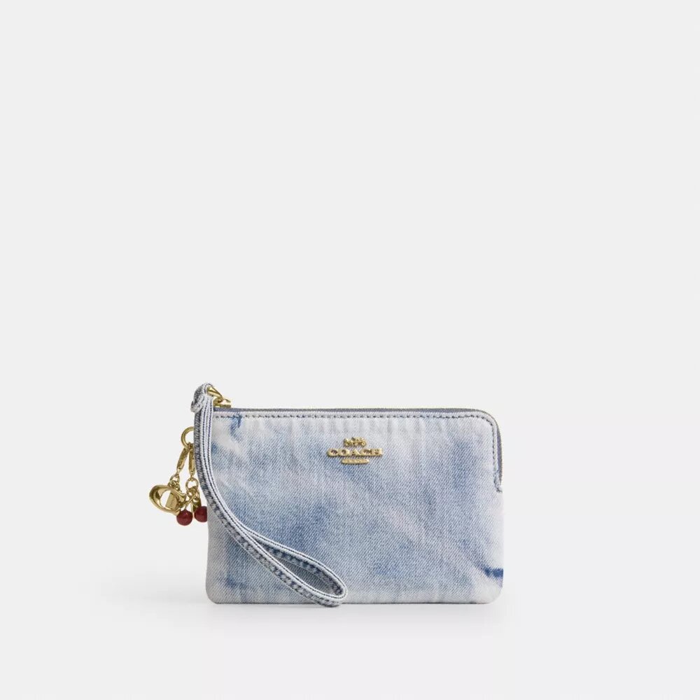 Bolso de pulsera con cremallera en las esquinas, en denim desgastado con Charms