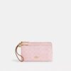 Bolso de pulsera con doble cremallera en Signature Canvas con Charms