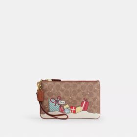 Bolso de pulsera pequeño «Essential» en Signature Canvas con regalos navideños