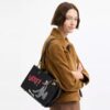 Bolso Disney X Coach Rogue 25 con Pluto
