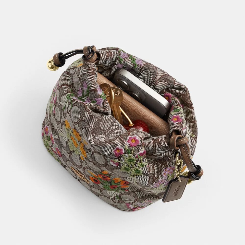 Bolso Faye Mini con cordón en jacquard exclusivo y bordado floral