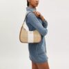 Bolso hobo Teri en Signature Canvas con rayas