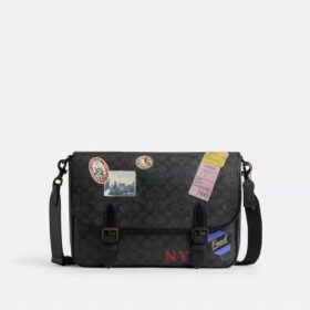 Bolso mensajero Hitch en Signature Canvas con parches
