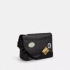 Bolso mensajero Hitch en Signature Canvas con parches
