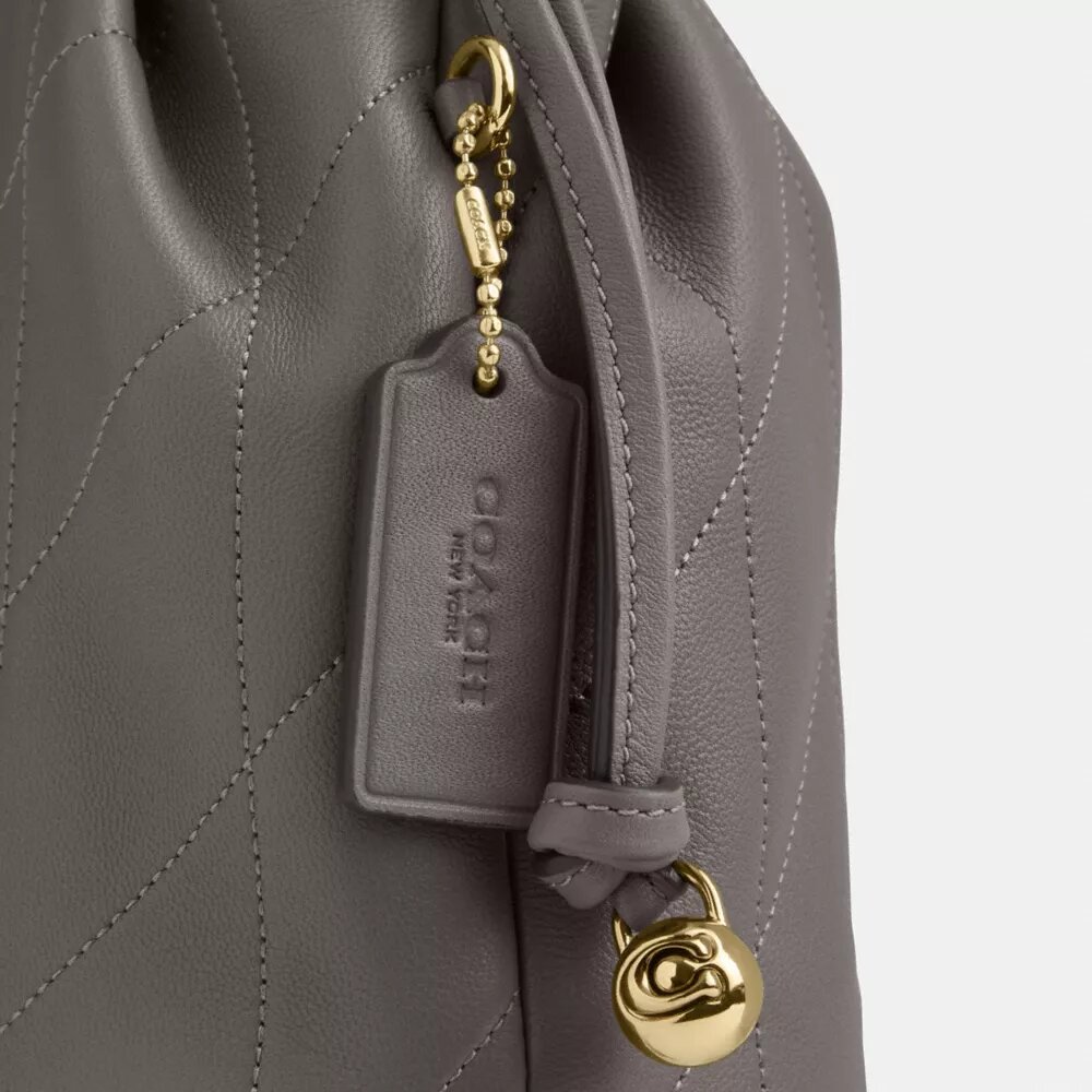 Bolso mini Faye con cordón y acolchado