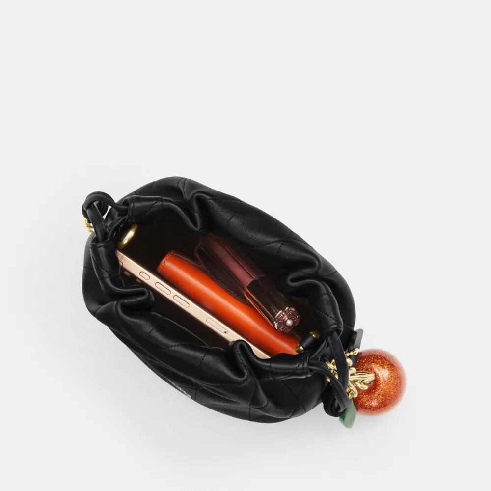 Bolso mini Faye con cordón y acolchado