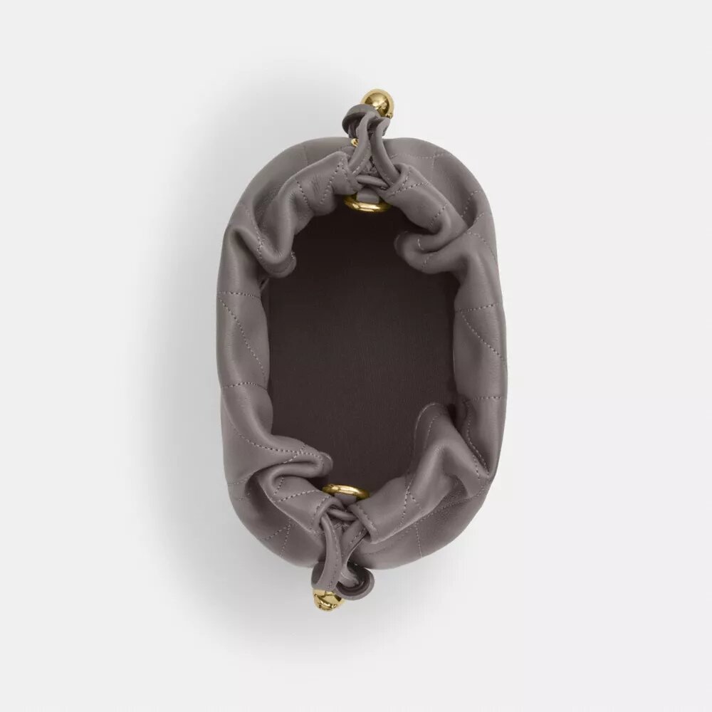 Bolso mini Faye con cordón y acolchado