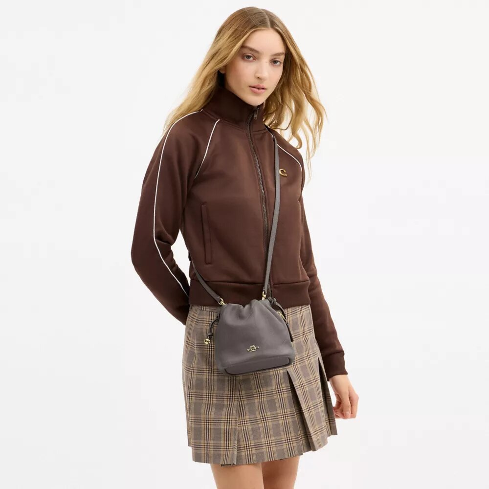 Bolso mini Faye con cordón y acolchado