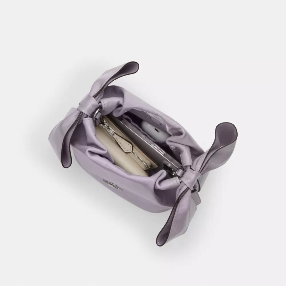 Bolso mini Faye con cordón y lazos