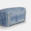 Bolso tipo cartera grande Rowan en denim desgastado con Charms