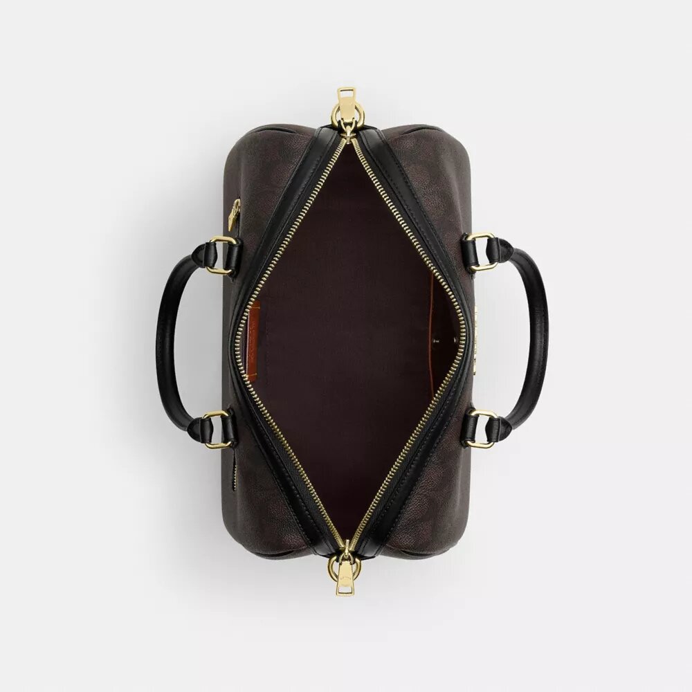 Bolso tipo cartera grande Rowan en Signature Canvas