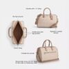Bolso tipo cartera grande Rowan en Signature Canvas
