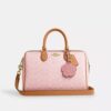 Bolso tipo cartera grande Rowan en Signature Canvas con Charms