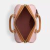 Bolso tipo cartera grande Rowan en Signature Canvas con Charms