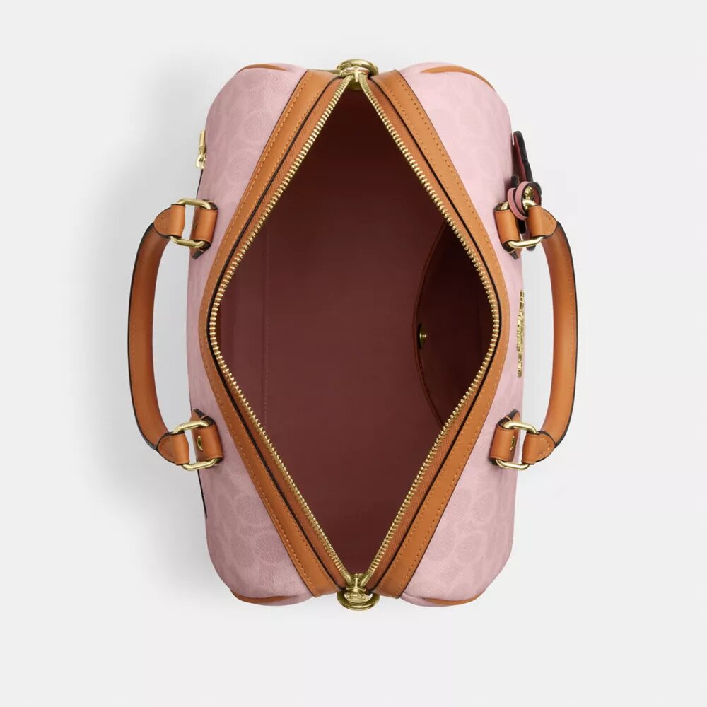 Bolso tipo cartera grande Rowan en Signature Canvas con Charms
