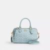 Bolso tipo cartera Rowan en Signature Canvas