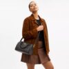 Bolso tipo cartera Rowan en Signature Canvas